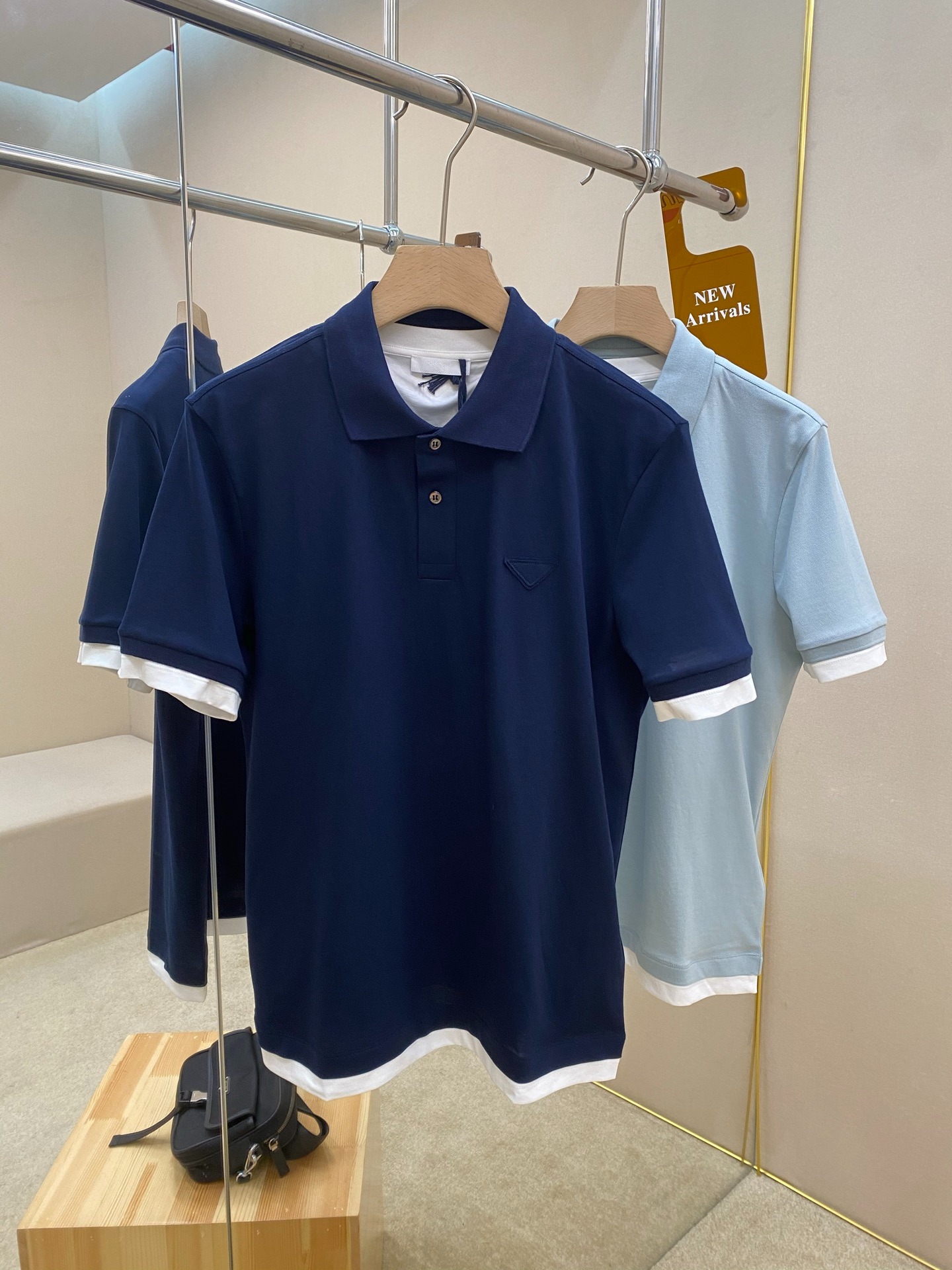 프*다 25SS 삼각 로고 면 폴로 셔츠