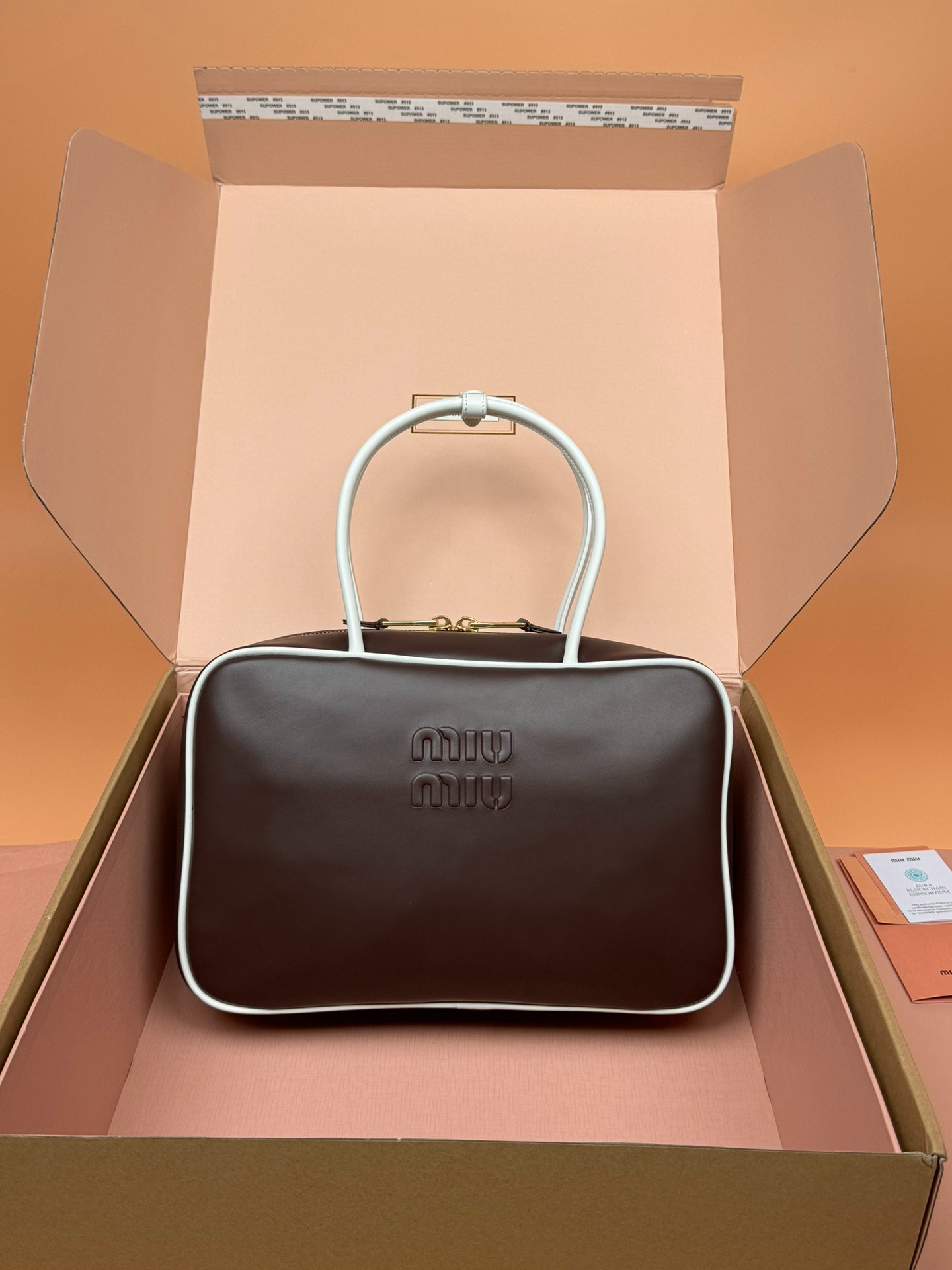 미우미우 탑 핸들 가죽 보 백